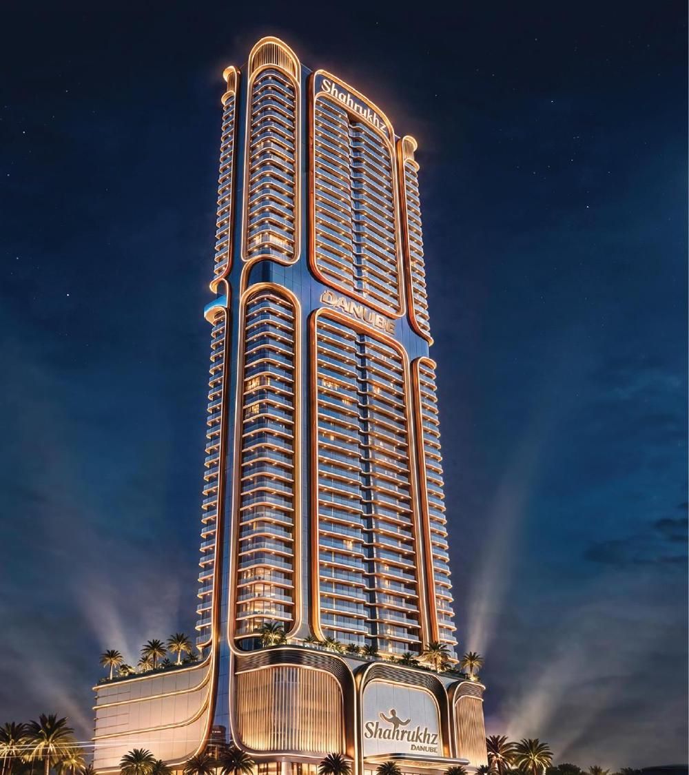 Shahrukhz Residences by Danube lit up at night on the Dubai waterfront